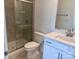 Bathroom with a glass-enclosed shower, white cabinets, and a modern sink at 13312 Chopin Ridge Rd, Huntersville, NC 28078