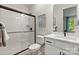 Modern bathroom with a glass-enclosed shower, white subway tile, and a sleek vanity at 13312 Chopin Ridge Rd, Huntersville, NC 28078