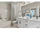 Bright bathroom with double vanity, framed mirrors, tub and shower, and neutral tones at 13312 Chopin Ridge Rd, Huntersville, NC 28078