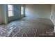 Bright, airy bedroom features carpeting and large windows at 13312 Chopin Ridge Rd, Huntersville, NC 28078