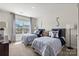 Bedroom featuring two beds, a large window with neighborhood views, and tasteful decor at 13312 Chopin Ridge Rd, Huntersville, NC 28078