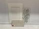 Selection of cabinet and tile samples featuring white cabinets and white quartz countertops with gray marbling at 13312 Chopin Ridge Rd, Huntersville, NC 28078