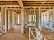 Unfinished interior framing for new home showcasing the layout, window locations, and natural light potential at 13312 Chopin Ridge Rd, Huntersville, NC 28078