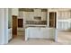 Unfinished kitchen with white cabinets and an island, ready to be completed at 13312 Chopin Ridge Rd, Huntersville, NC 28078