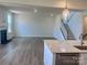 Spacious living room features a fireplace and a staircase, complemented by modern flooring at 13312 Chopin Ridge Rd, Huntersville, NC 28078