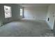 Large, empty room with natural light streaming through windows, ready to be customized at 13312 Chopin Ridge Rd, Huntersville, NC 28078