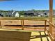 New deck construction overlooking a graded backyard with views of neighboring houses in the distance at 13312 Chopin Ridge Rd, Huntersville, NC 28078