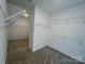 Walk-in closet with wire shelving for organized storage and ample space for clothing and accessories at 13312 Chopin Ridge Rd, Huntersville, NC 28078