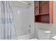 Bathroom includes shower/tub combo and a wooden cabinet at 13823 Waverton Ln, Huntersville, NC 28078