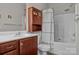 Clean bathroom with tub shower, vanity, and linen cabinet at 13823 Waverton Ln, Huntersville, NC 28078