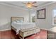 Bright bedroom with wood floors and ceiling fan at 13823 Waverton Ln, Huntersville, NC 28078