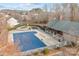 Aerial view of community pool, pavilion, playground, and surrounding homes at 13823 Waverton Ln, Huntersville, NC 28078