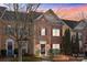 Evening view of a charming brick front townhouse at 13823 Waverton Ln, Huntersville, NC 28078