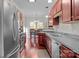 Modern kitchen with stainless steel appliances and dark wood cabinets at 13823 Waverton Ln, Huntersville, NC 28078