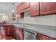 Clean kitchen with gray countertops and stainless steel dishwasher at 13823 Waverton Ln, Huntersville, NC 28078