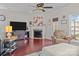 Spacious living room with hardwood floors and a fireplace at 13823 Waverton Ln, Huntersville, NC 28078