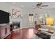 Cozy living room featuring a fireplace and hardwood floors at 13823 Waverton Ln, Huntersville, NC 28078