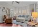 Relaxing living room with comfortable seating and large windows at 13823 Waverton Ln, Huntersville, NC 28078