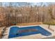 Community pool with wooden deck and safety cover at 13823 Waverton Ln, Huntersville, NC 28078