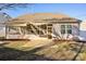 Screened porch with a shade sail in the backyard at 145 Chertsey Dr, Mooresville, NC 28115