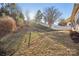 Sloped backyard with landscaping and privacy fence at 145 Chertsey Dr, Mooresville, NC 28115