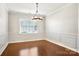 Formal dining room with hardwood floors and chandelier at 145 Chertsey Dr, Mooresville, NC 28115