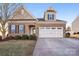 Two-story home with a two-car garage and manicured lawn at 145 Chertsey Dr, Mooresville, NC 28115