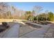 Community playground with swings and play structure at 145 Chertsey Dr, Mooresville, NC 28115