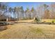 Community playground area with playset and swings at 145 Chertsey Dr, Mooresville, NC 28115