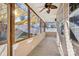 Relaxing screened porch with ceiling fan and shade sails at 145 Chertsey Dr, Mooresville, NC 28115