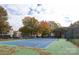 Well-maintained community tennis court, surrounded by trees and foliage, offers recreational opportunities at 18742 Nautical Dr # 305, Cornelius, NC 28031