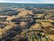 Aerial view of large lot near residential area with a pond at 222 Ingram Rd, Statesville, NC 28625