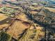 Aerial view of property with a pond and nearby homes at 222 Ingram Rd, Statesville, NC 28625