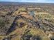 Aerial view of expansive land with pond and neighboring houses at 222 Ingram Rd, Statesville, NC 28625