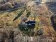 Aerial view of a house on a large lot with surrounding fields at 222 Ingram Rd, Statesville, NC 28625