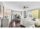 Serene bedroom with hardwood floors, large windows, and a ceiling fan at 222 Ingram Rd, Statesville, NC 28625