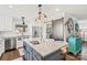 Kitchen island with seating, stainless steel appliances, and farmhouse sink at 222 Ingram Rd, Statesville, NC 28625