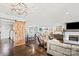 Open living space with a fireplace, hardwood floors, and barn door at 222 Ingram Rd, Statesville, NC 28625