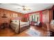 Bedroom with wood walls, floors, and a built-in wooden cabinet at 2452 Nc 182 Hwy, Lincolnton, NC 28092