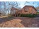 House showcasing sunroom and landscaping at 2452 Nc 182 Hwy, Lincolnton, NC 28092