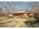 Brick ranch house with covered porch and mature trees at 2452 Nc 182 Hwy, Lincolnton, NC 28092