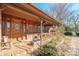 Inviting front porch with wooden flooring and brick steps at 2452 Nc 182 Hwy, Lincolnton, NC 28092