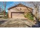 Attached brick garage with large door and spacious driveway at 2452 Nc 182 Hwy, Lincolnton, NC 28092