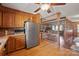 Open kitchen with stainless steel refrigerator and view into adjoining living area at 2452 Nc 182 Hwy, Lincolnton, NC 28092