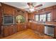 Rustic kitchen with wood cabinets, brick accent wall, and stainless steel appliances at 2452 Nc 182 Hwy, Lincolnton, NC 28092