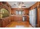 Kitchen with wood cabinets, brick accent wall, and stainless steel appliances at 2452 Nc 182 Hwy, Lincolnton, NC 28092