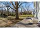 Deck overlooking a spacious backyard with large trees at 2717 Madison Oaks Ct, Charlotte, NC 28226