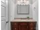 Small bathroom with granite countertop and dark wood vanity at 2717 Madison Oaks Ct, Charlotte, NC 28226