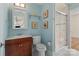 Light blue bathroom with single vanity, toilet, and shower at 2717 Madison Oaks Ct, Charlotte, NC 28226