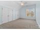 Bright bedroom featuring double doors and a window with a view at 2717 Madison Oaks Ct, Charlotte, NC 28226